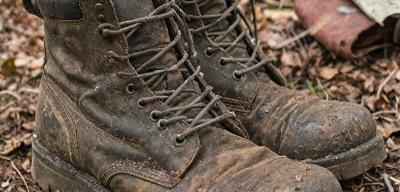 Well-worn work boots before restoration