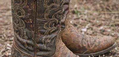 Worn cowboy boots before restoration