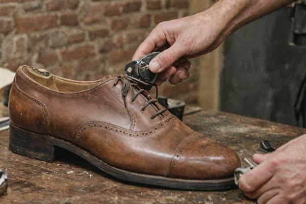Final quality inspection of completed shoe restoration